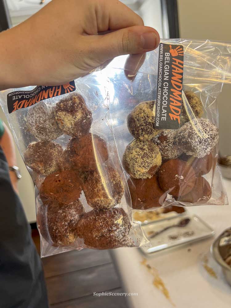 Fresh handmade Belgian chocolate truffles packed in a clear plastic bag after a chocolate-making workshop in Brussels.
