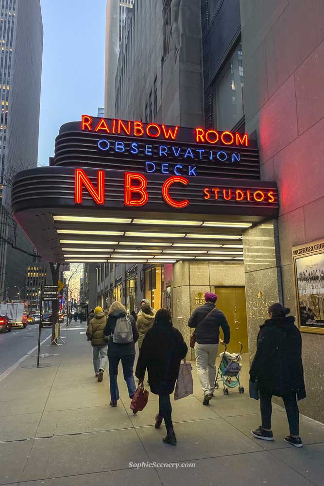 NBC studio entrance for the Tonight show starring Jimmy Fallon Entrance of NBC Studios at Rockefeller Center with the Rainbow Room marquee glowing at dusk, as visitors walk toward The Tonight Show with Jimmy Fallon taping.